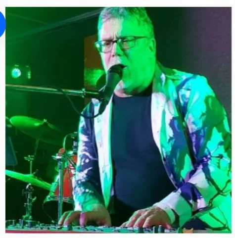 Roy performing in signature jacket